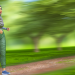 A person running in a park, depicting regular