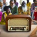 An image showing a crowd gathered around a radio listening to a broadcast, indicating mass communication.