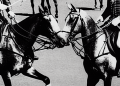 A black and white image of historical European monarchs on horseback playing polo