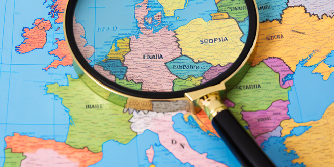 A magnifying glass placed on a world map, symbolic of detective work across European territories