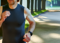 A person jogging in the park as a way to cope with stress