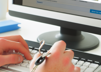 An individual sitting at their computer, registering for an online sweepstake with key personal information.