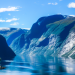 Breathtaking view of the fjords in Norway under the crystal clear blue sky