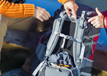 Guide demonstrating the correct way to pack a backpack for a mountain hike
