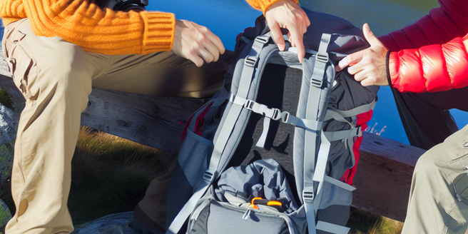 Guide demonstrating the correct way to pack a backpack for a mountain hike