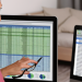 Woman looking at a computer screen showing spreadsheet of tracking results